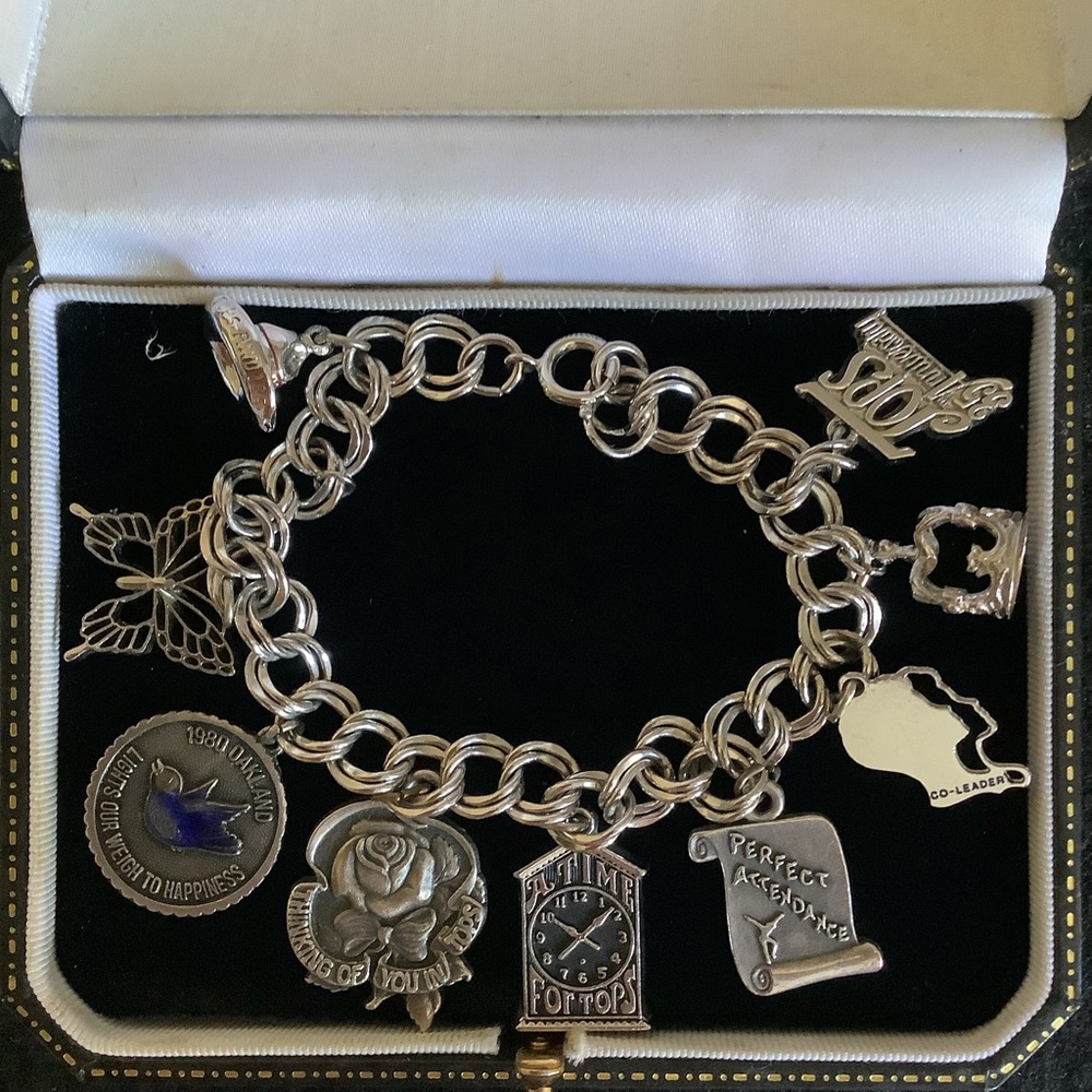 Vintage Tops silver tone charm bracelet.